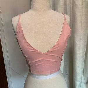 Pink back tie crop top. Never been worn.